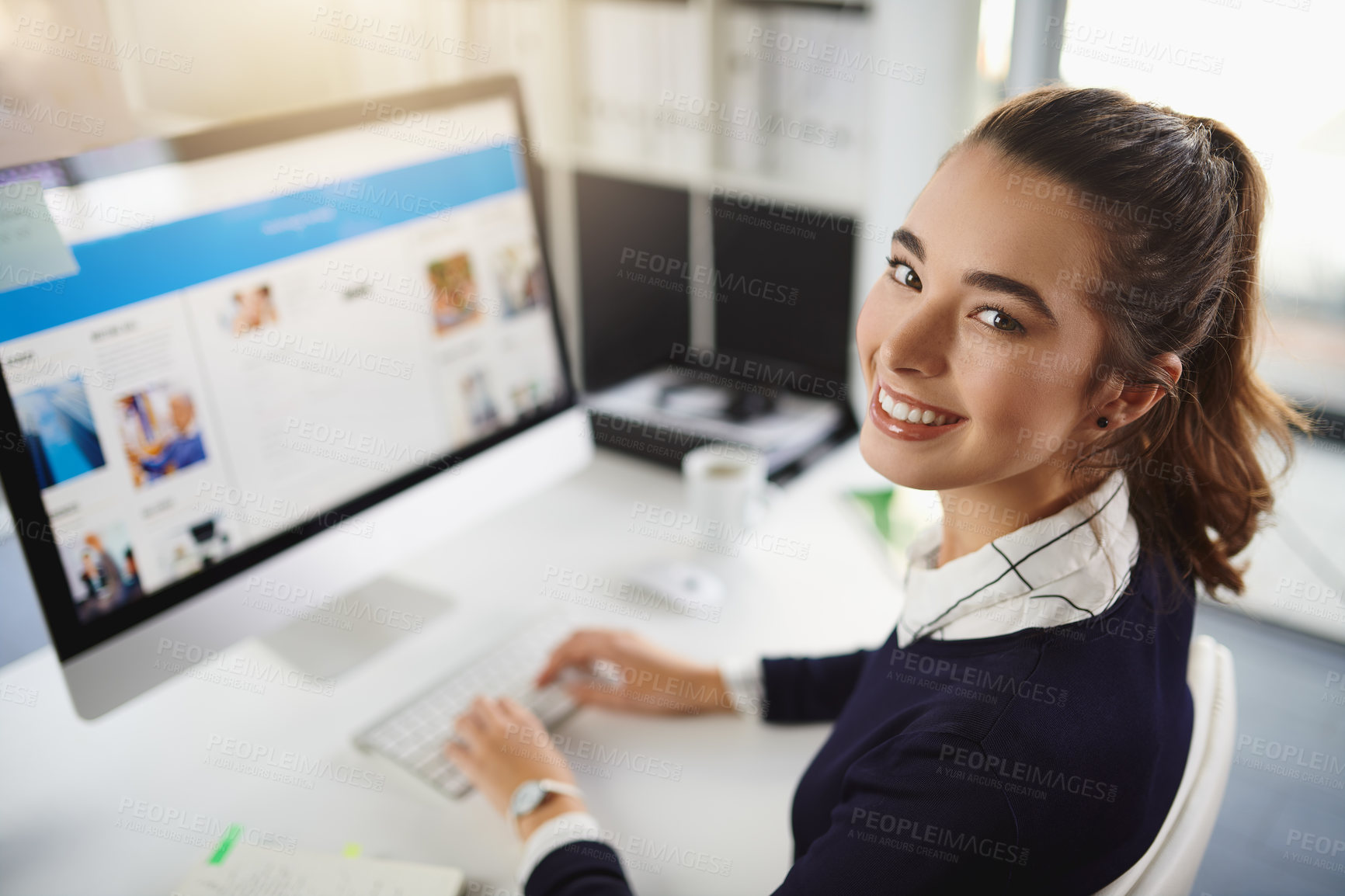 Buy stock photo Woman, happy and typing in portrait, office and startup with website, copywriting and editing at media company. Person, writer and smile with pc, screen and excited at creative agency in Italy