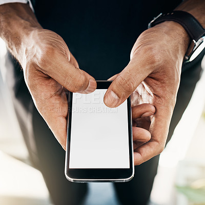 Buy stock photo Cropped shot of a businessman using a mobile phone in an office