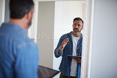 Buy stock photo Cropped shot of an attractive mature man having a rehearsal in the mirror while holding a digital tablet