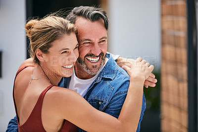 Buy stock photo Cropped portrait of an affectionate couple posing for a photograph outdoors