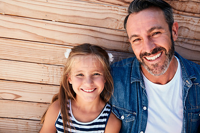 Buy stock photo Portrait of an adorable little girl spending quality time with her father at home