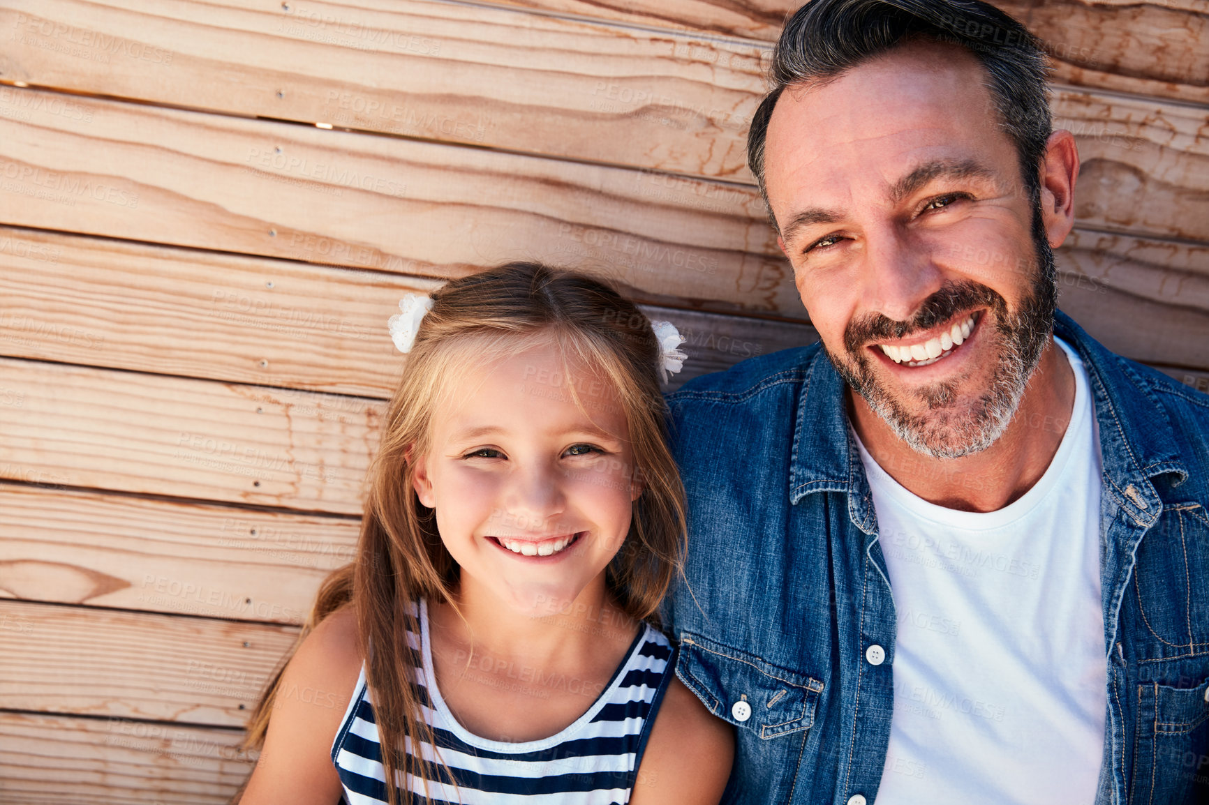 Buy stock photo Portrait of an adorable little girl spending quality time with her father at home