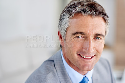 Buy stock photo Headshot of a confident mature businessman smiling and wearing a suit indoors