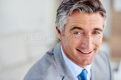 Buy stock photo Headshot of a confident mature businessman smiling and wearing a suit indoors