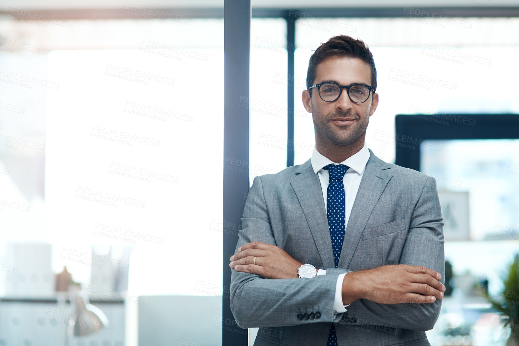 Buy stock photo Portrait of a well-dressed businessman standing in his office