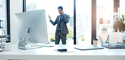 Buy stock photo Shot of a businessman talking on his cellphone while standing in his office
