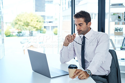Buy stock photo Cropped shot of a businessman sitting at his desk