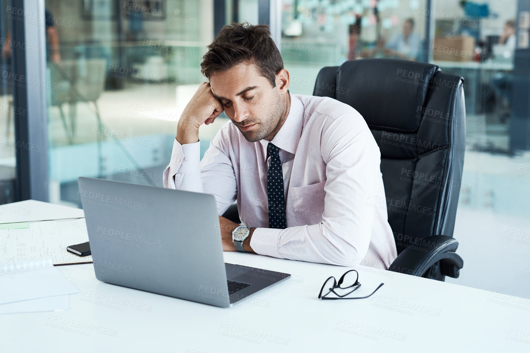 Buy stock photo Shot of a businessman sleeping at his desk
