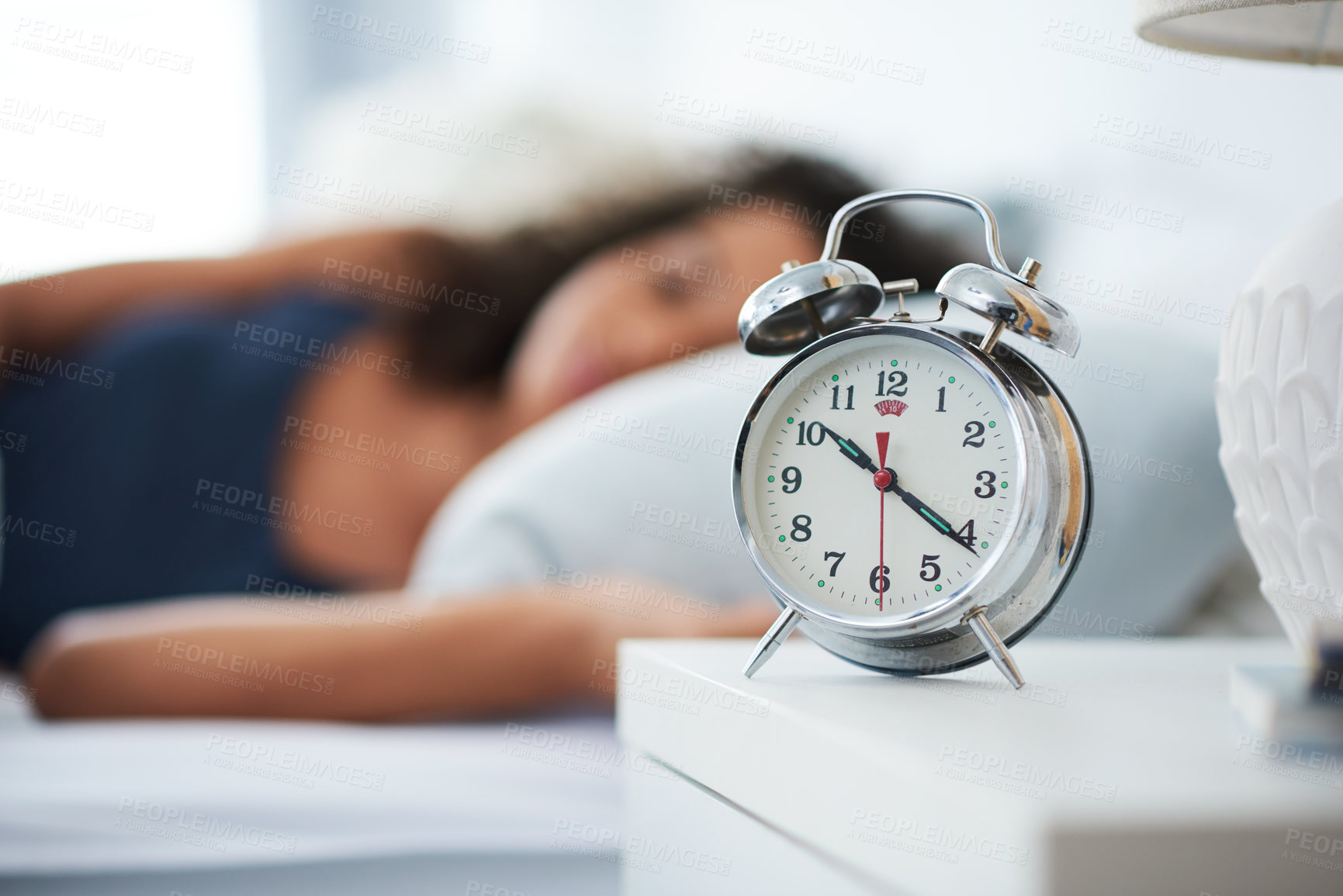 Buy stock photo Alarm, clock and woman sleeping in bed with depression, tired or anemia and low energy or fatigue at home. Time, late and person dreaming, relax or lying with risk of iron deficiency or hypersomnia