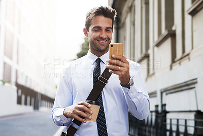 Buy stock photo Coffee, mobile and business man in city for reading email, update or news on commute outdoor. Phone, drink and happy worker in town online for info, notification or check agenda app to plan schedule