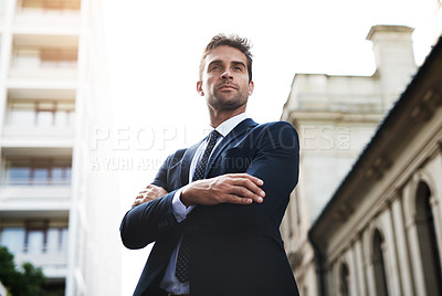 Buy stock photo Shot of a handsome young businessman on his morning commute to work