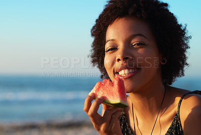 Buy stock photo Portrait of an attractive single young woman eating a watermelon piece on the beach during the day
