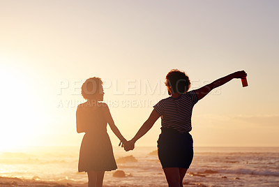 Buy stock photo Friends, holding hands and back in beach, sunset and bonding in vacation, love and support in nature. Outdoor, travel and people in holiday, calm and women in journey for fun in ocean and San Diego