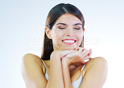 Buy stock photo Cropped shot of a beautiful young woman posing against a white background