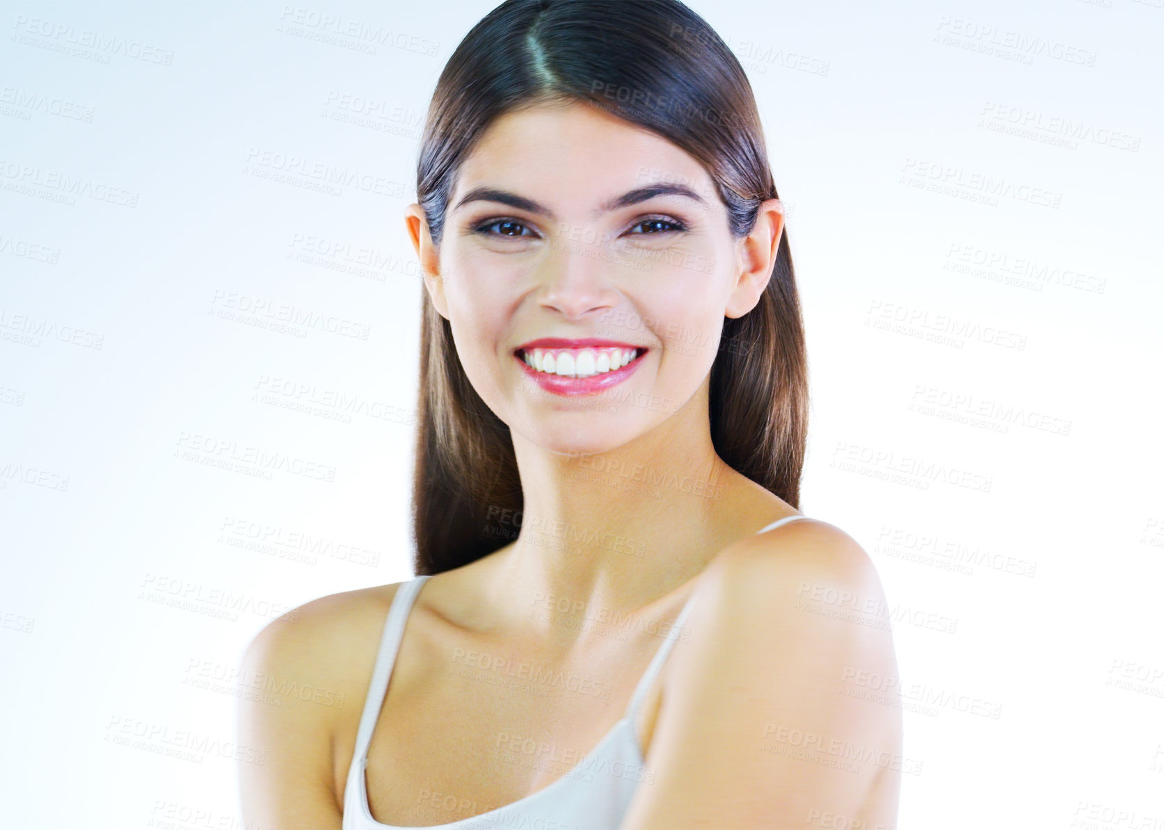 Buy stock photo Cropped shot of a beautiful young woman posing against a white background