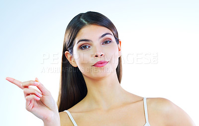 Buy stock photo Cropped shot of a beautiful young woman posing against a white background