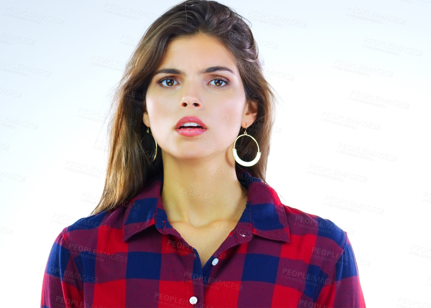 Buy stock photo Portrait of a young woman posing against a white background