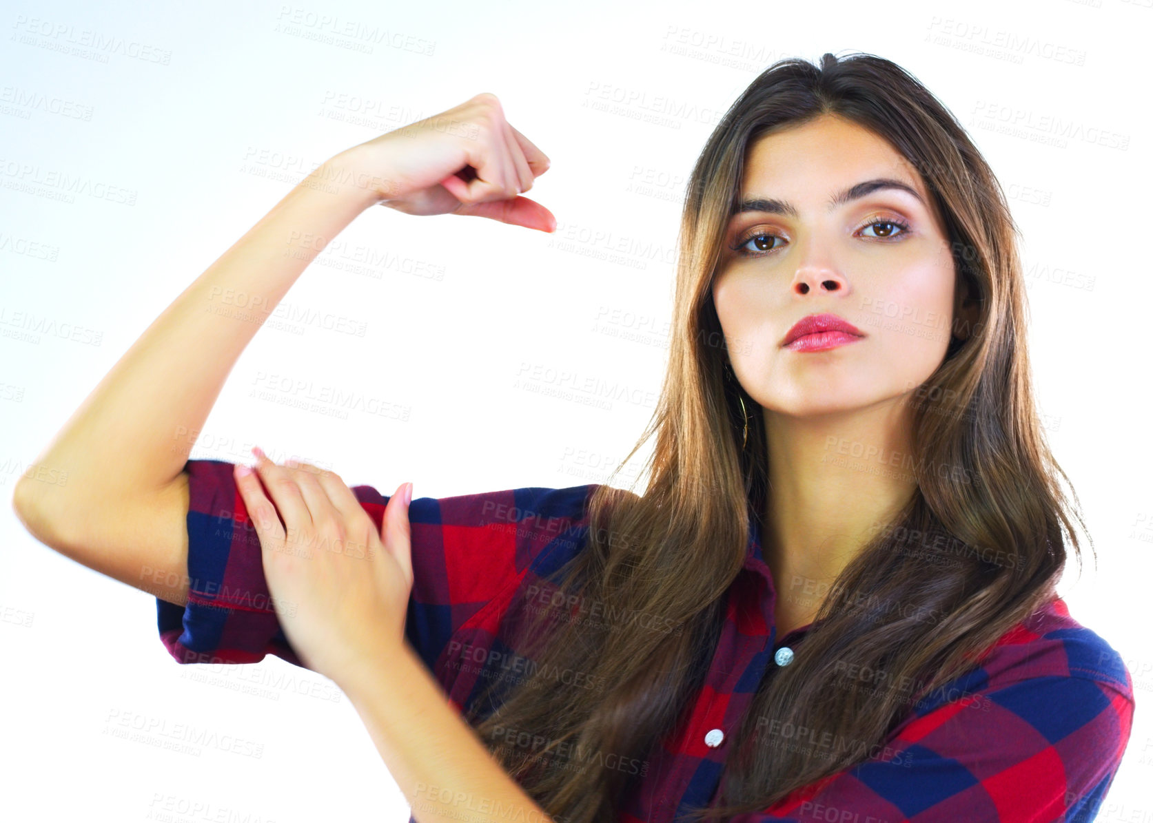 Buy stock photo Cropped shot of a young woman flexing her muscles against a white background