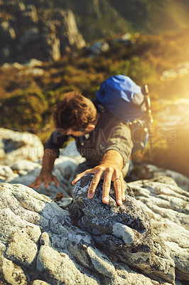 Buy stock photo Man, climbing and mountain with rocks outdoor of fitness adventure, sports challenge and hiking travel. Male person, backpack and support with trekking, balance and exercise performance to explore