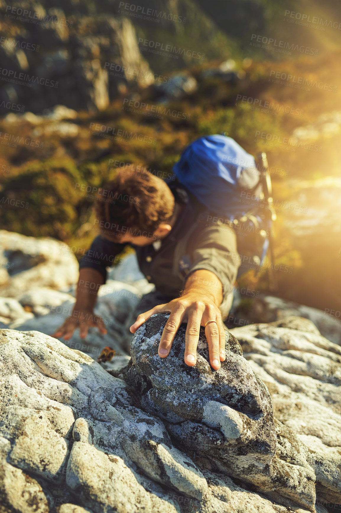 Buy stock photo Man, climbing and mountain with rocks outdoor of fitness adventure, sports challenge and hiking travel. Male person, backpack and support with trekking, balance and exercise performance to explore