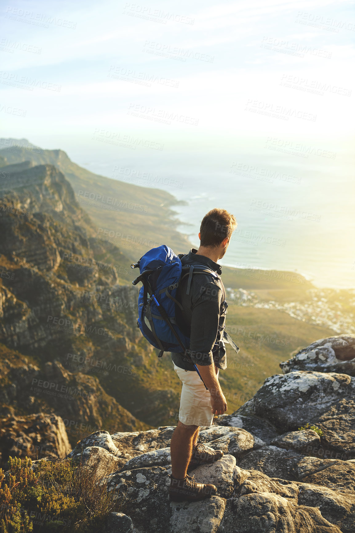 Buy stock photo Man, mountain and backpacking for outdoor freedom, travel and hiking in nature for tourism journey. Male person, trekking and athlete for sky mockup space, adventure and exercise for back on workout