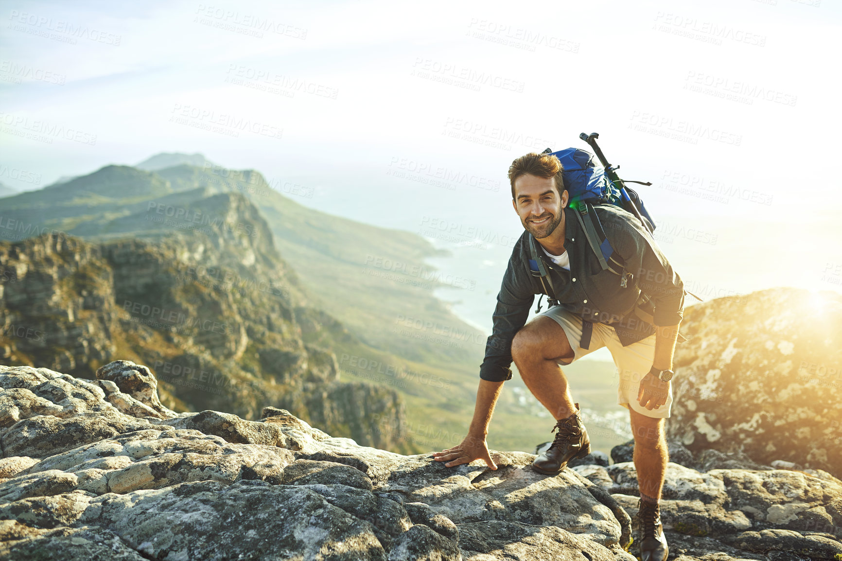 Buy stock photo Man, climbing and mountain with portrait outdoor for fitness adventure, sports challenge and hiking travel. Male person, backpack and rocks with trekking, balance and exercise performance for explore