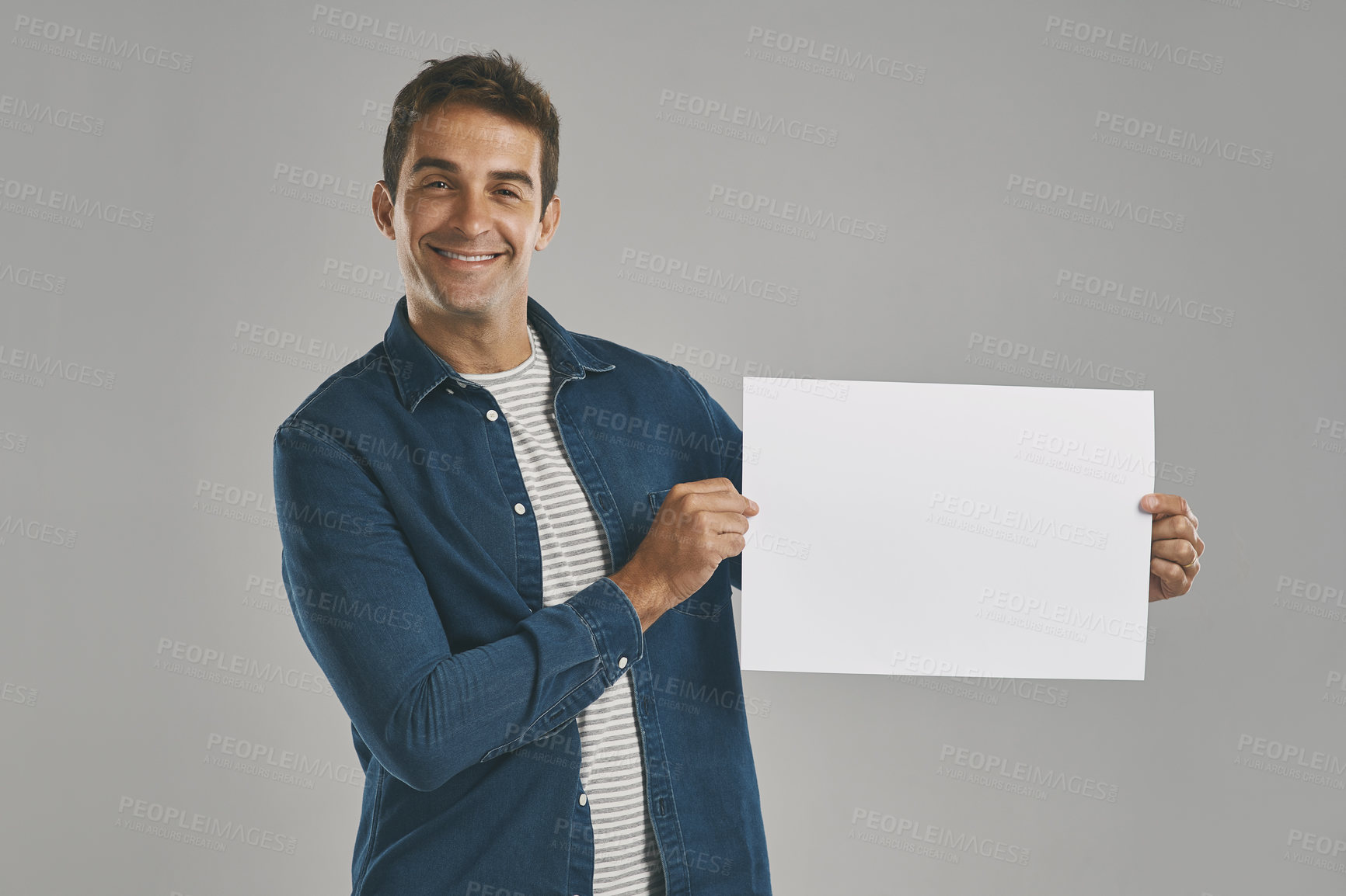Buy stock photo Portrait, smile and man with poster, blank and promotion with happy guy on gray studio background. Face, person and model with billboard, opportunity and design with confidence, sales or mockup space