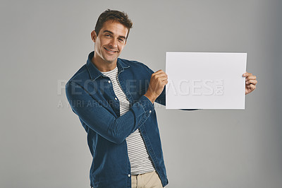 Buy stock photo Portrait, choice and man with poster, blank or promotion with happy guy on gray studio background. Face, person or model with billboard, opportunity or design with announcement, sales or mockup space