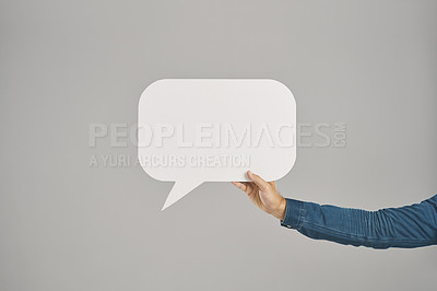 Buy stock photo Studio shot of an unrecognisable man holding a speech bubble against a grey background