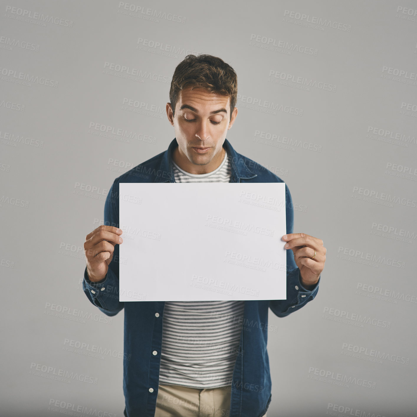 Buy stock photo Man, poster and promotion mockup in studio or announcement placard, advertising or grey background. Male person, banner and information sign for news deal with sales bulletin, ambassador or choice