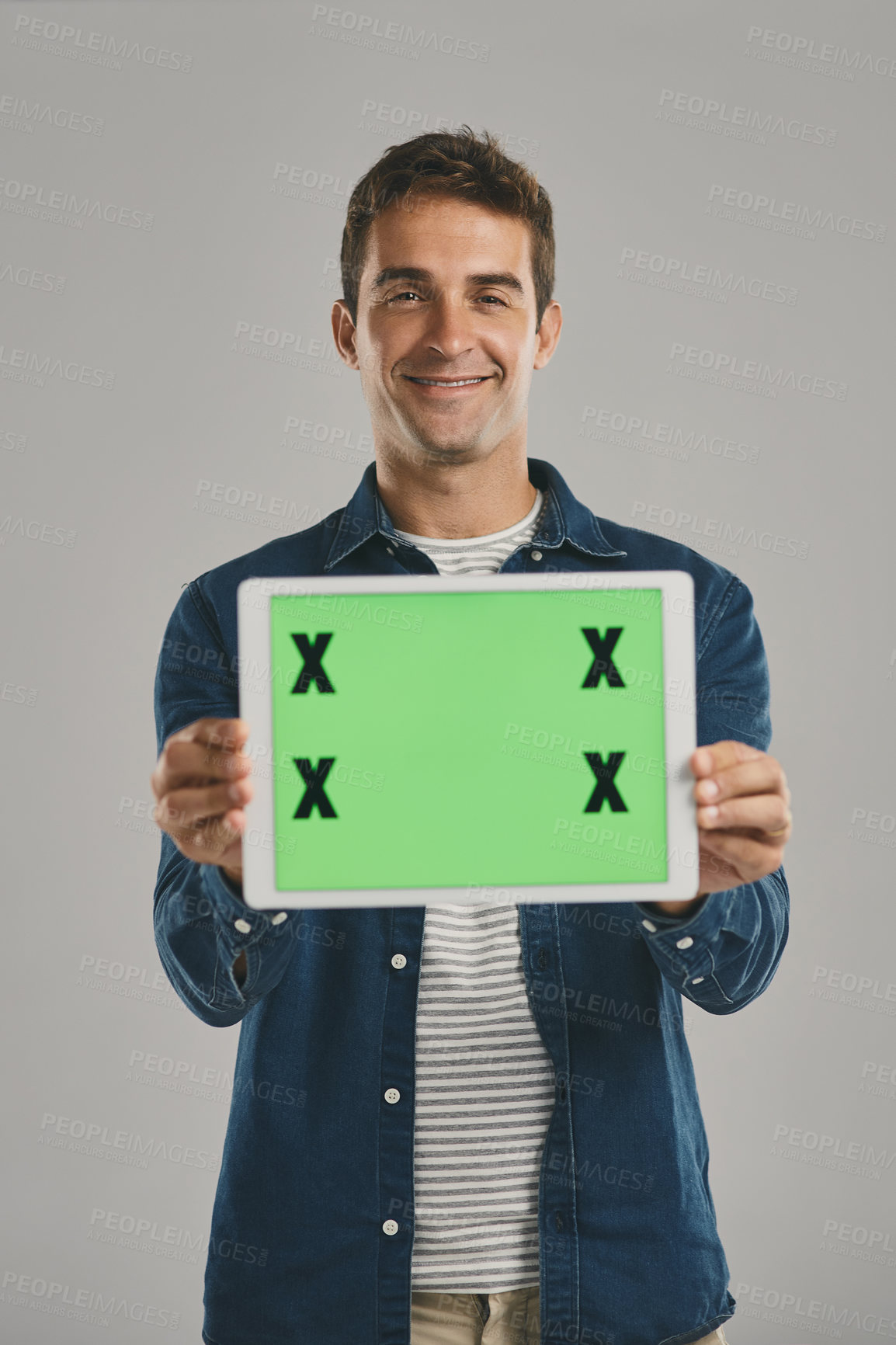Buy stock photo Portrait, green screen and man with tablet, showing and happy person on gray studio background. Face, guy and model with tech, tracking markers and promotion with internet, digital app and connection