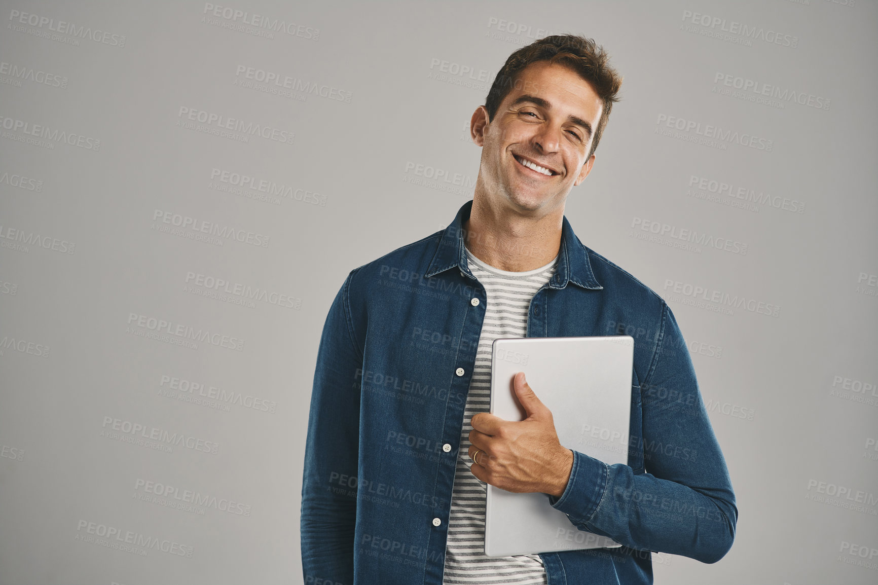 Buy stock photo Happy, portrait and tablet with man in studio isolated on gray background for app download or update. Ecommerce, social media and website with smile of user in casual outfit for online shopping