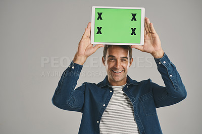 Buy stock photo Portrait, green screen and man with tablet, excited and happy person on gray studio background. Face, guy or model with tech, tracking markers or connection with internet, digital app or website info