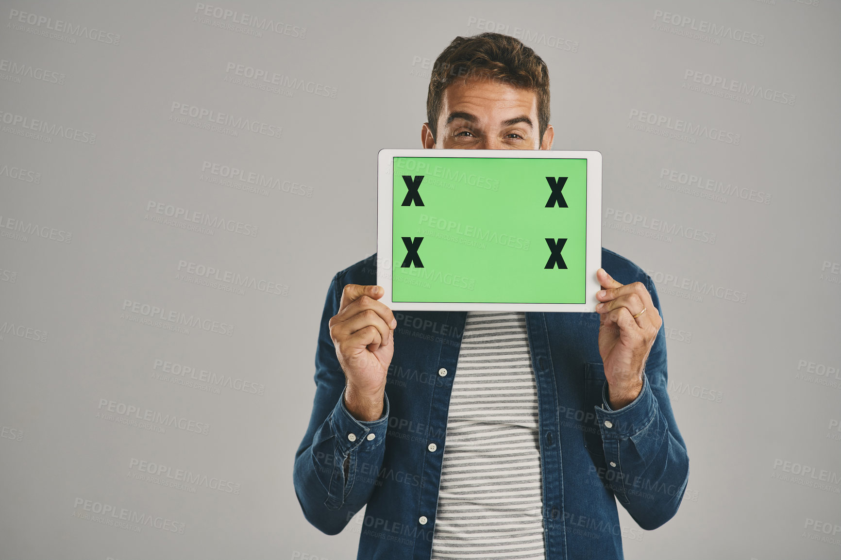 Buy stock photo Portrait, green screen and man with tablet, network and person on gray studio background. Face, opportunity or model with tech, tracking markers and promotion with internet, digital app or logo