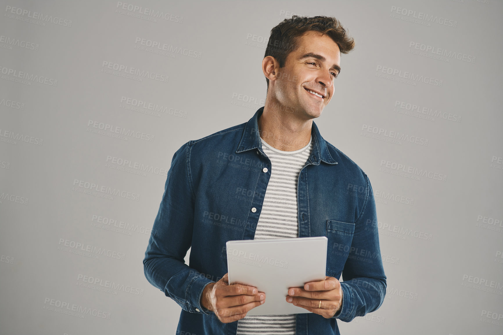 Buy stock photo Idea, smile and tablet with man in studio isolated on gray background for app download or update. Ecommerce, social media and thinking with happy user in casual outfit for online shopping or retail