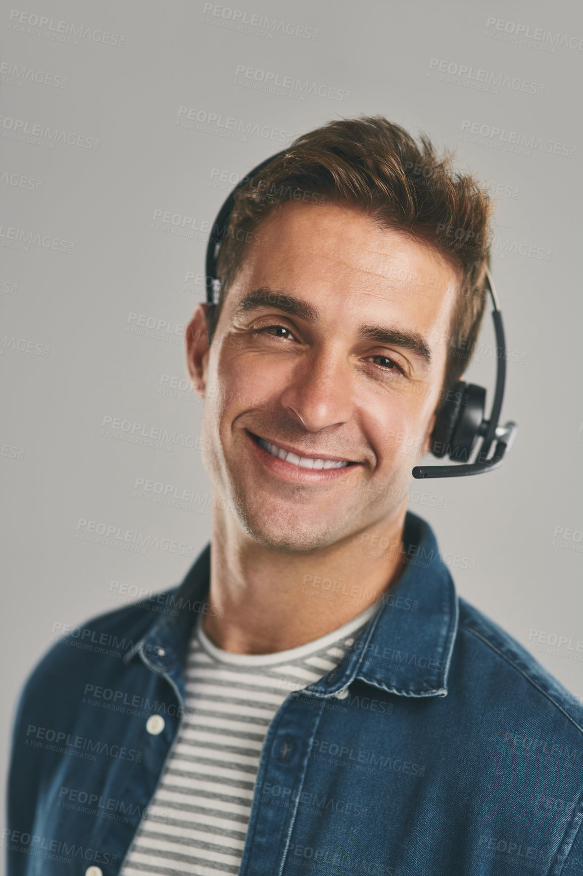 Buy stock photo Man, portrait and headset for call centre communication on grey background, contact us or customer support. Male person, face and studio for telemarketing sales or technical advice, crm or helping