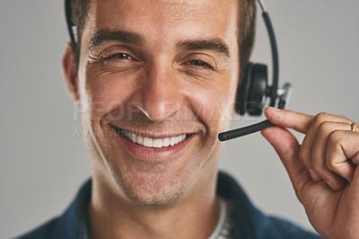 Buy stock photo Man, portrait and headset for call centre consultant on grey background, contact us or customer service. Male person, face and studio for telemarketing as technical support, microphone or help desk