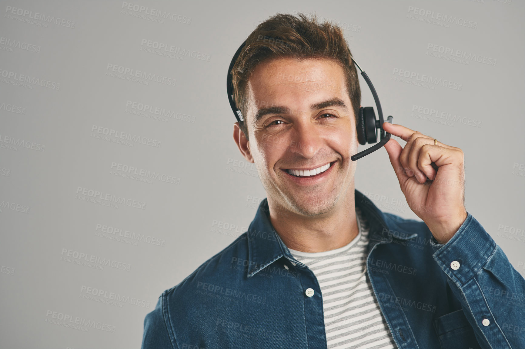 Buy stock photo Man, portrait and headset for call centre telemarketing on grey background in studio, contact us or mockup space. Male person, face and help desk for customer service, technical support or hotline