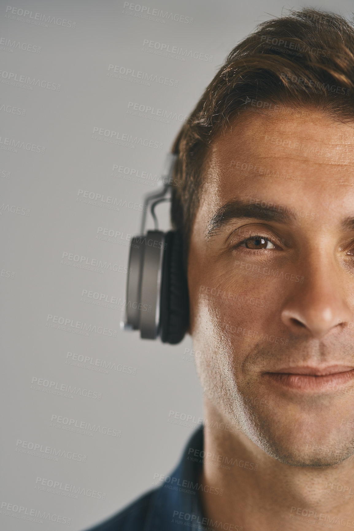 Buy stock photo Portrait, music and man with headphones, studio and streaming of song, artist and relax with podcast. Listening, happy and sound of radio, hearing and audio for person, app and subscription in Canada