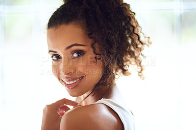Buy stock photo Cropped portrait of an attractive young woman posing in her bedroom at home