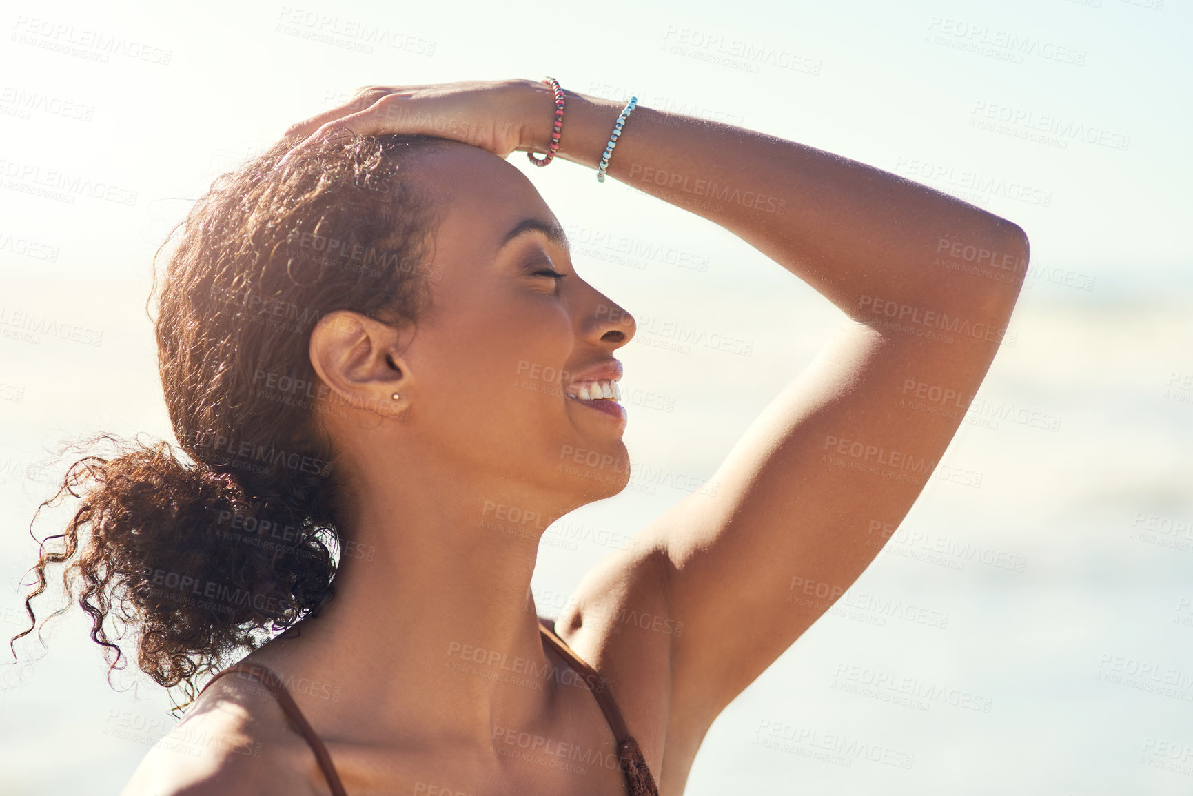 Buy stock photo Woman, smile and calm at beach for freedom, travel and relax in outdoor on vacation at sea. Female person, profile and holiday in nature by waves, tropical and island adventure for peace at ocean