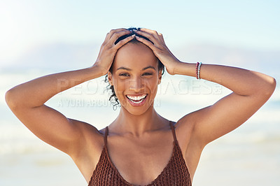 Buy stock photo Cropped shot of a beautiful young woman spending the day at the beach