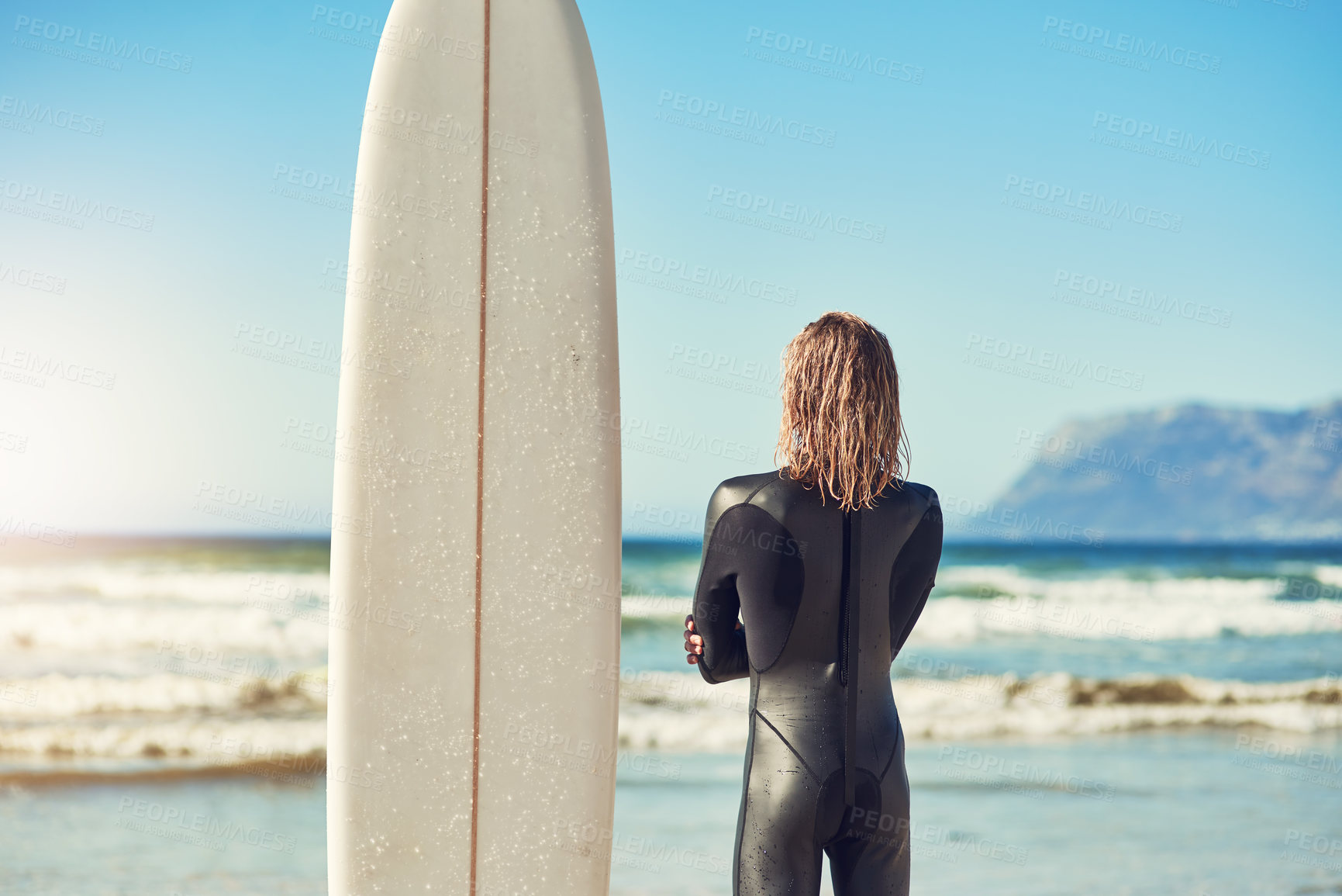 Buy stock photo Man, back and board for surfing by ocean, workout and training for water sports on island. Male person, health and travel to beach or sea for waves, adventure and athlete for exercise in nature