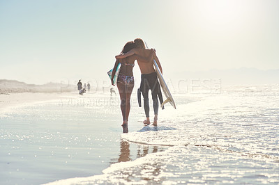 Buy stock photo Love, hug and couple with surfboard at a beach for summer, fun and bonding on vacation in nature. Sunset, back or surfer people embrace while walking at sea for travel, romance or anniversary holiday