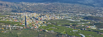 Buy stock photo Aerial landscape view of fruit plantations outside the city of La Palma, Spain. Tropical scenic hills, farming, infrastructure and architecture buildings. Travel abroad to tourism destination