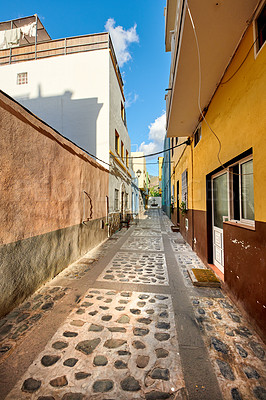 Buy stock photo Scenic street view of vibrant residential buildings, old historic houses, traditional infrastructure in stone alleyway road. Tourism abroad, overseas travel destination in Santa Cruz, La Palma, Spain