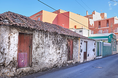 Buy stock photo Exterior of a decaying brick building. Architecture of an abandoned property or an old vintage demolished house with a weathered roof on a narrow street in Santa Cruz de La Palma