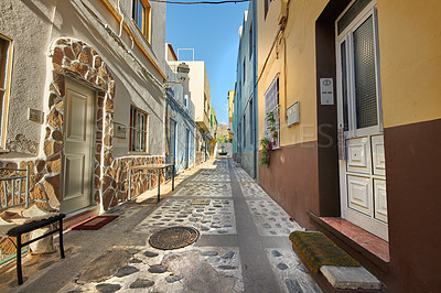 Buy stock photo Scenic street view of old historic houses, residential buildings, traditional infrastructure in cobblestone alleyway road. Tourism abroad, overseas travel destination in Santa Cruz de La Palma, Spain