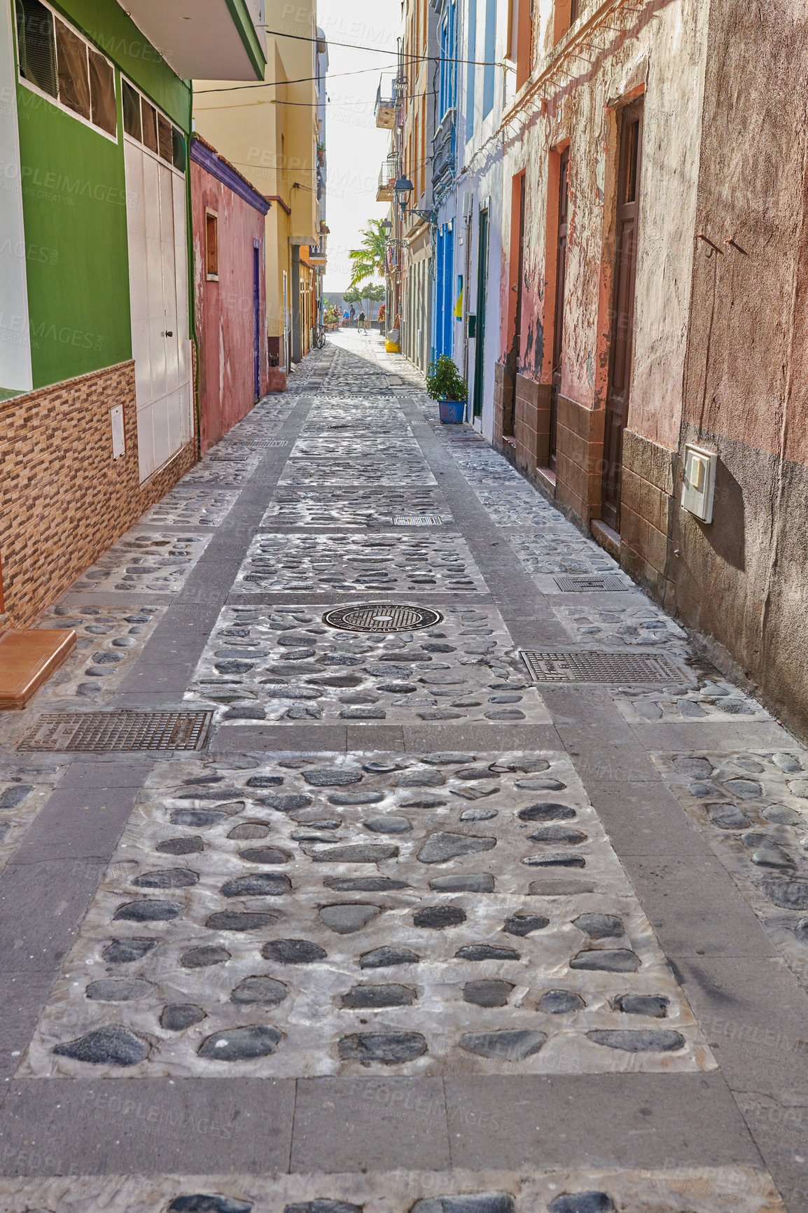 Buy stock photo City street view of residential houses or buildings in leading alleyway in Santa Cruz, La Palma, Spain. Historical spanish and colonial architecture in tropical village and famous tourism destination