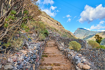 Buy stock photo Mountain, path and landscape with steps, clouds and environment with ecology and growth in Spain. Travel, tourism and La Palma with blue sky, countryside and sustainability for outdoor destination